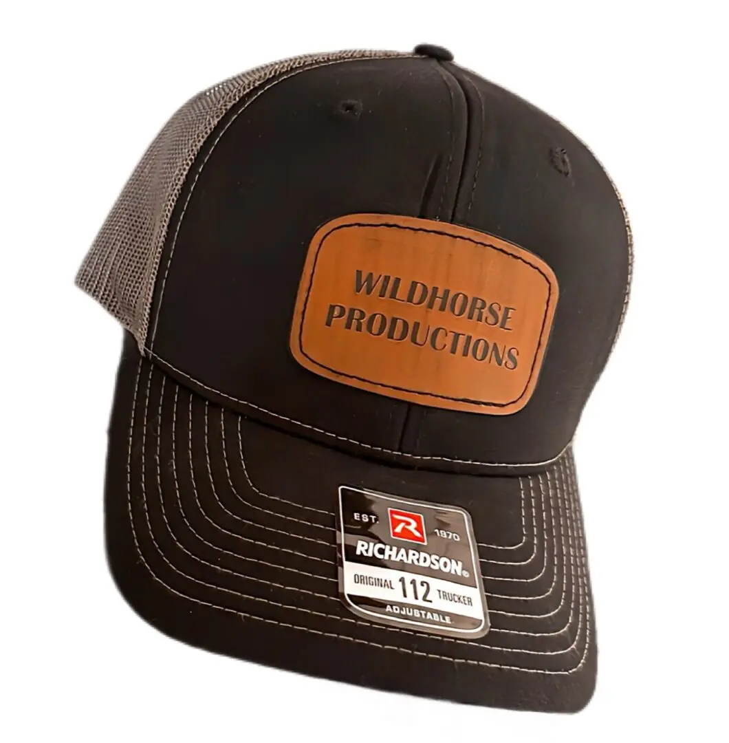 A black and brown hat with an orange patch.
